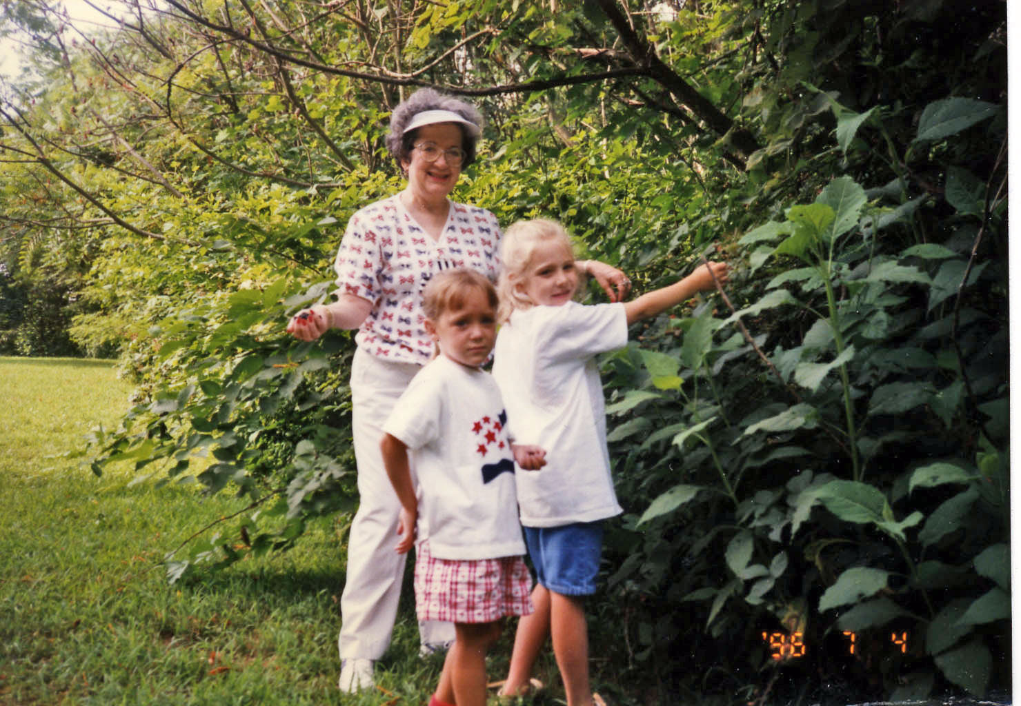Megan, Mom, and Katie picking blackberries